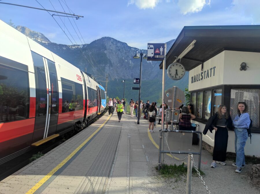 ÖBB train arriving at Hallstatt Bahnhof station during a day trip from Salzburg